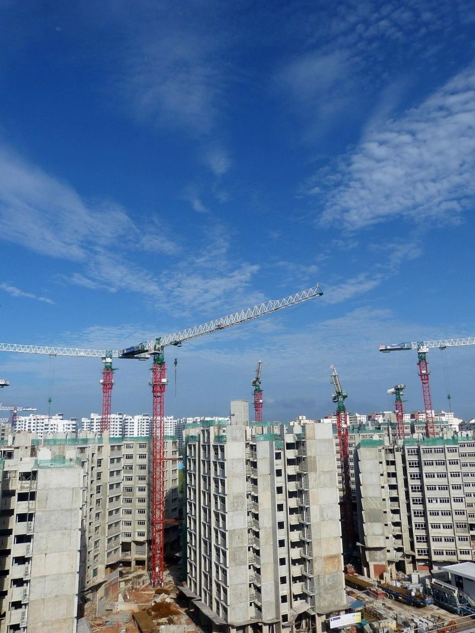 New residential blocks under construction with tower cranes